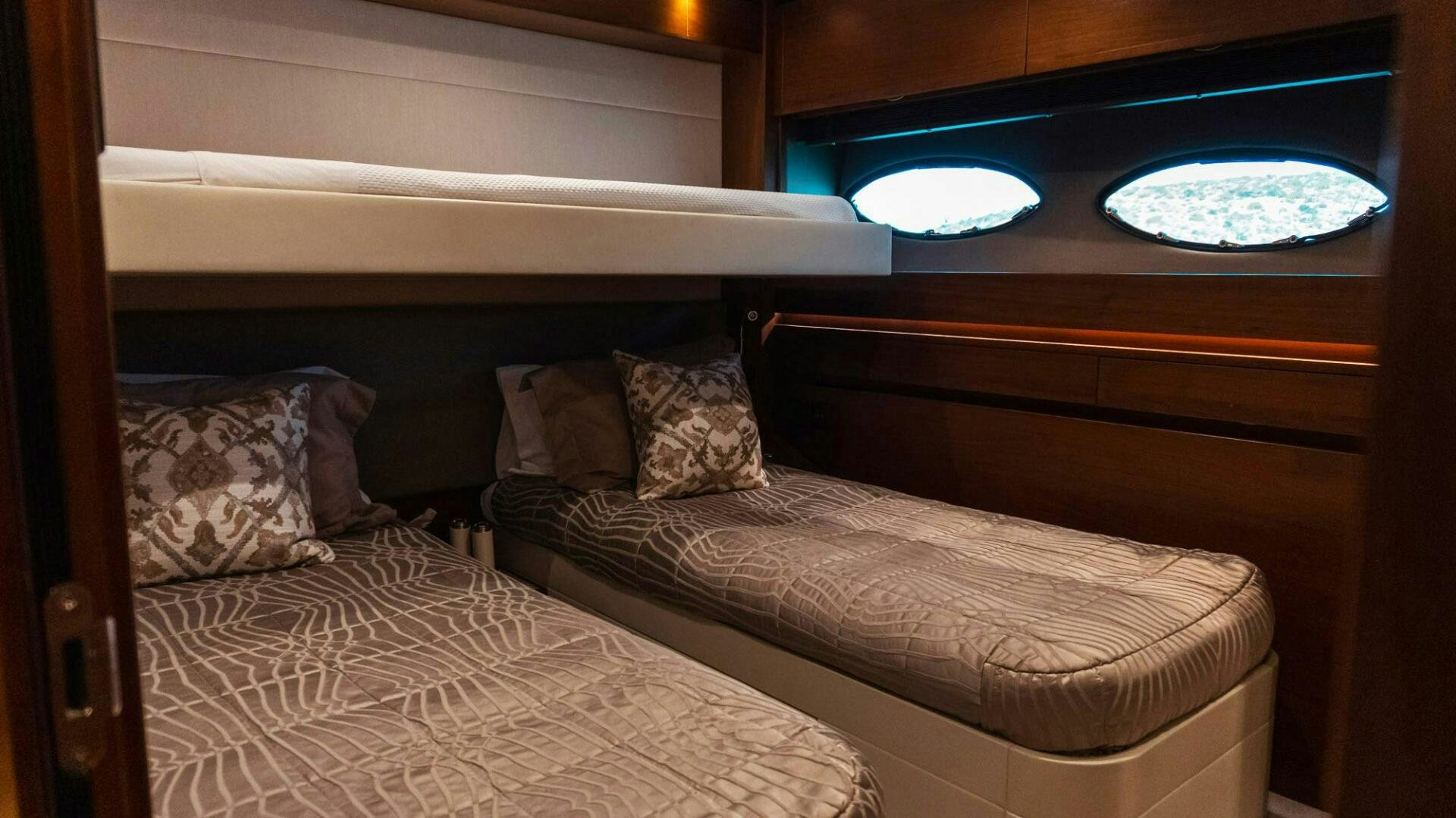a bed with a couple of pillows aboard SATORI Yacht for Sale