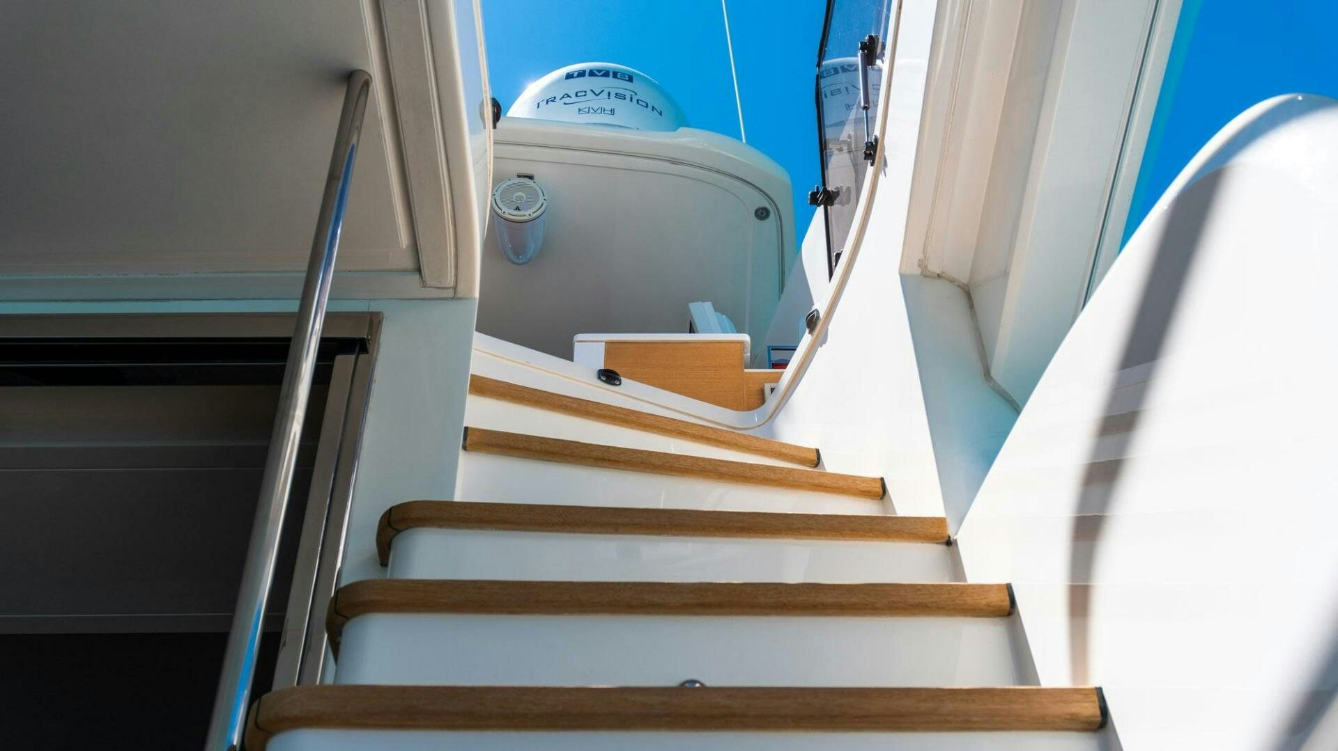 a wooden staircase with a sign on it aboard SATORI Yacht for Sale