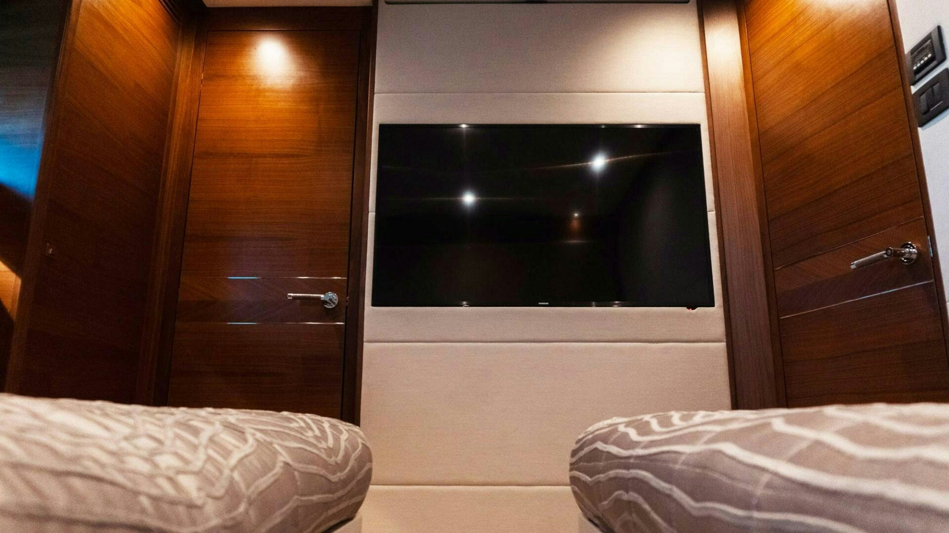 a bed next to a closet aboard SATORI Yacht for Sale