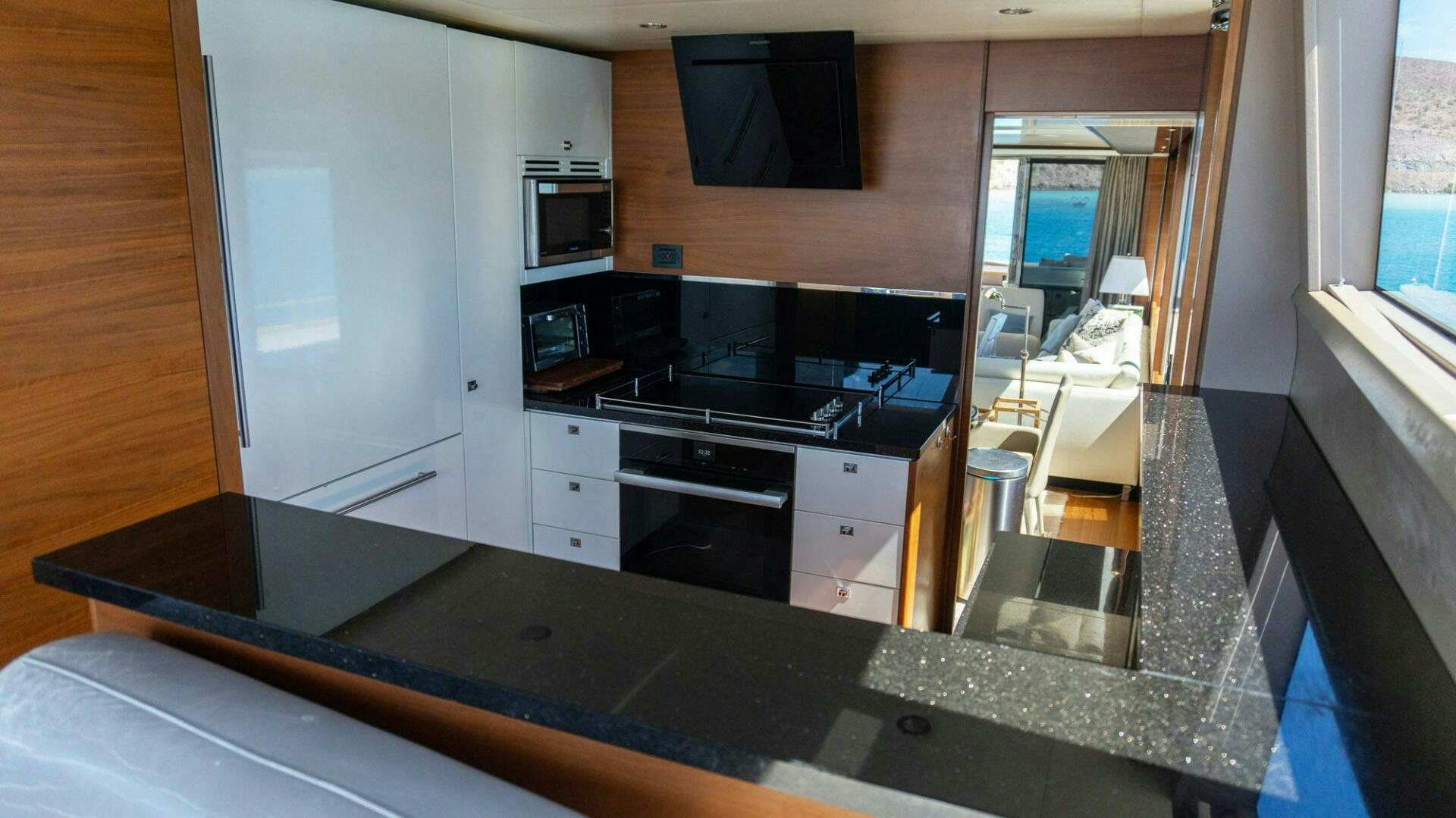 a kitchen with a large island aboard SATORI Yacht for Sale