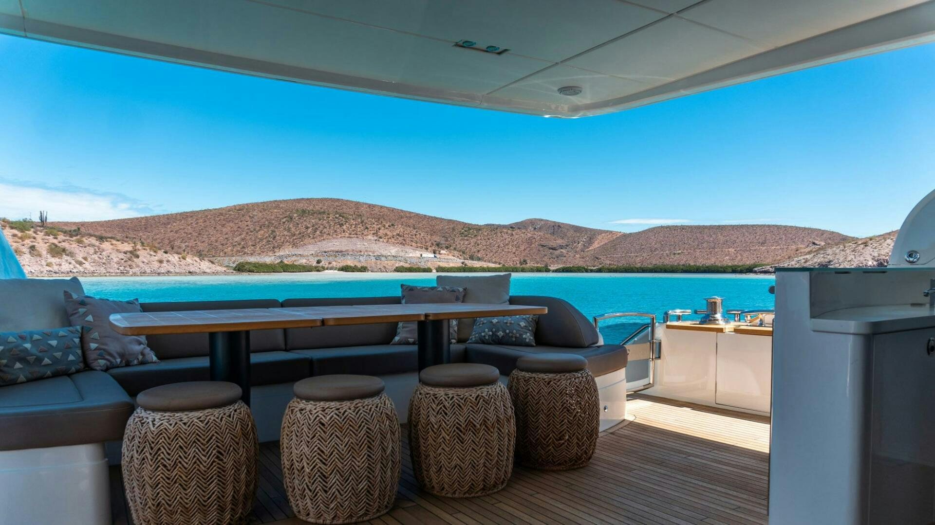a table with chairs on it aboard SATORI Yacht for Sale