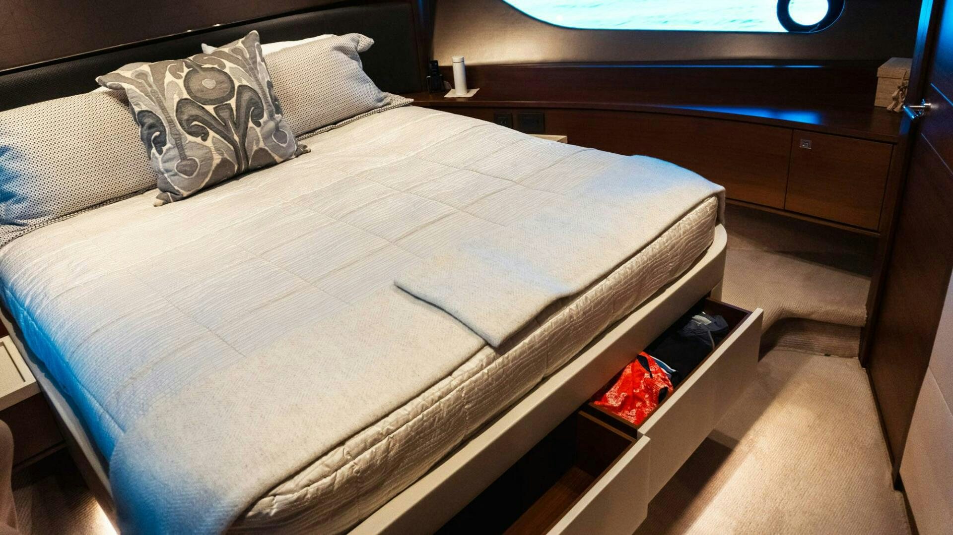 a bed with a white sheet aboard SATORI Yacht for Sale