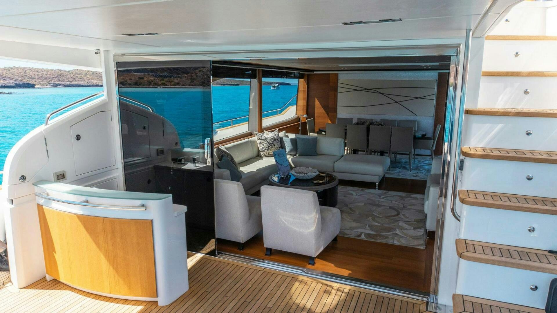 a room with a couch and a table aboard SATORI Yacht for Sale