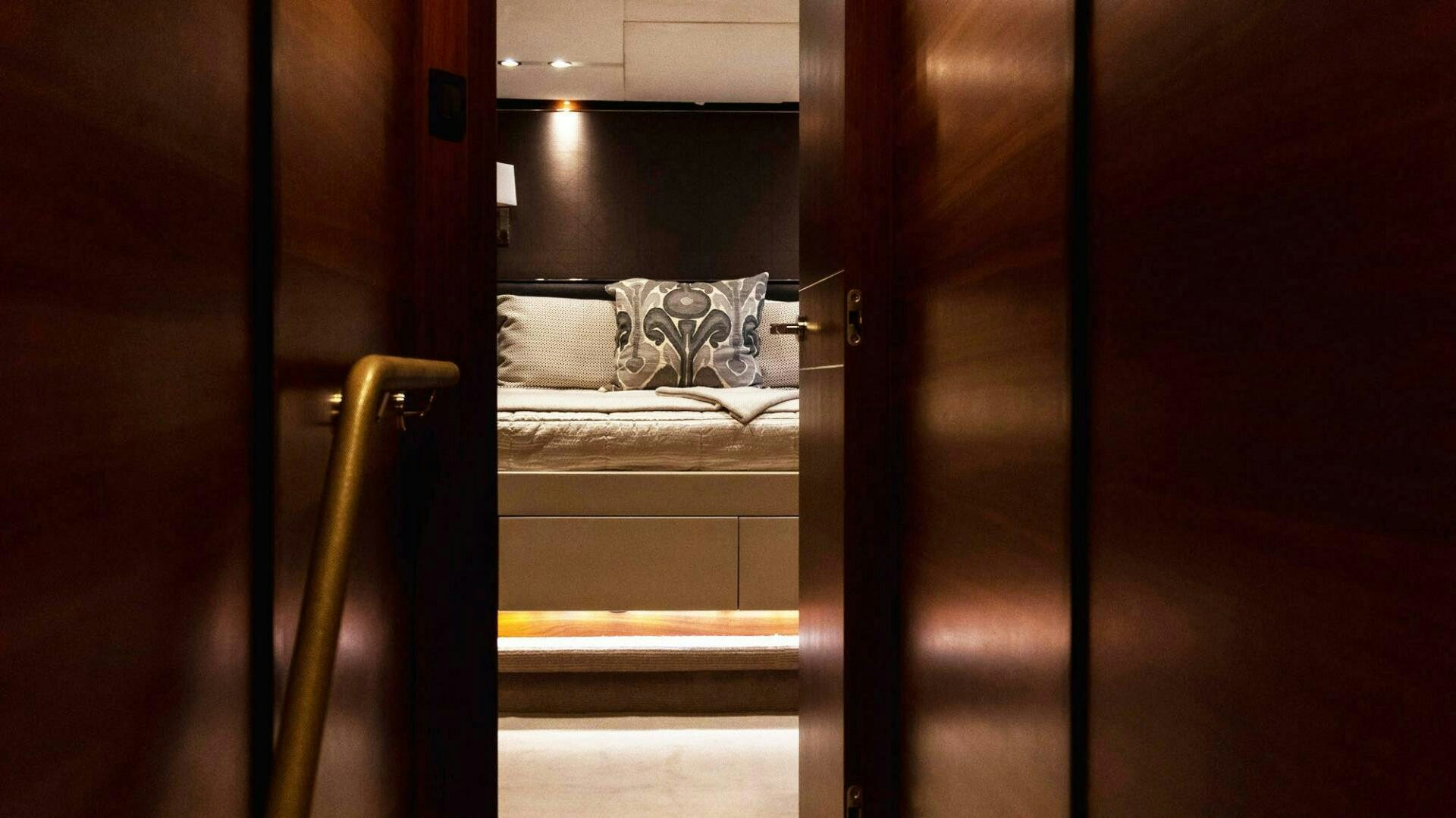 a room with a bed and a door aboard SATORI Yacht for Sale