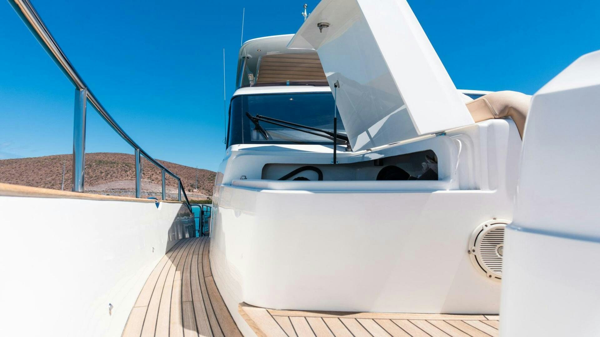 a white car on a road aboard SATORI Yacht for Sale
