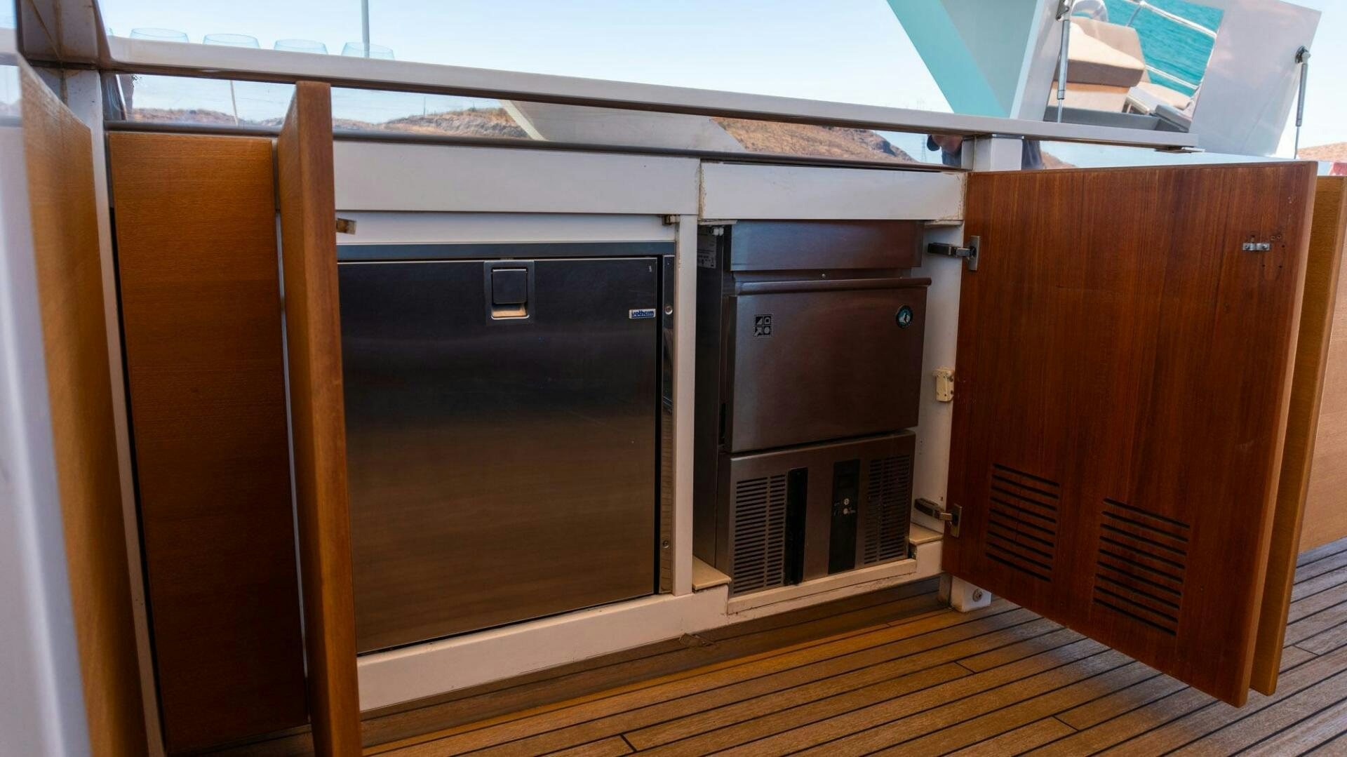 a group of wooden cabinets aboard SATORI Yacht for Sale