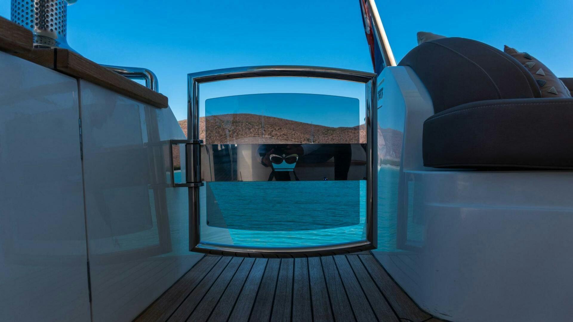 a room with a view of the ocean and a beach aboard SATORI Yacht for Sale