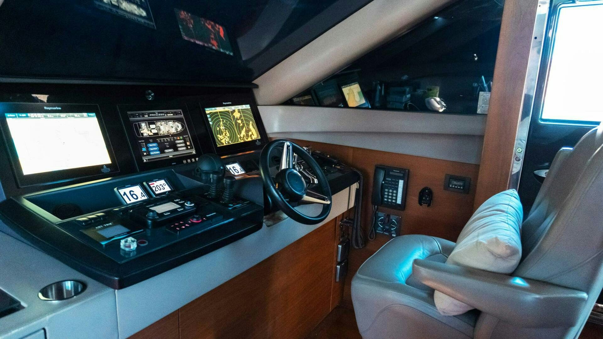 a person in a room with a machine and a fan aboard SATORI Yacht for Sale