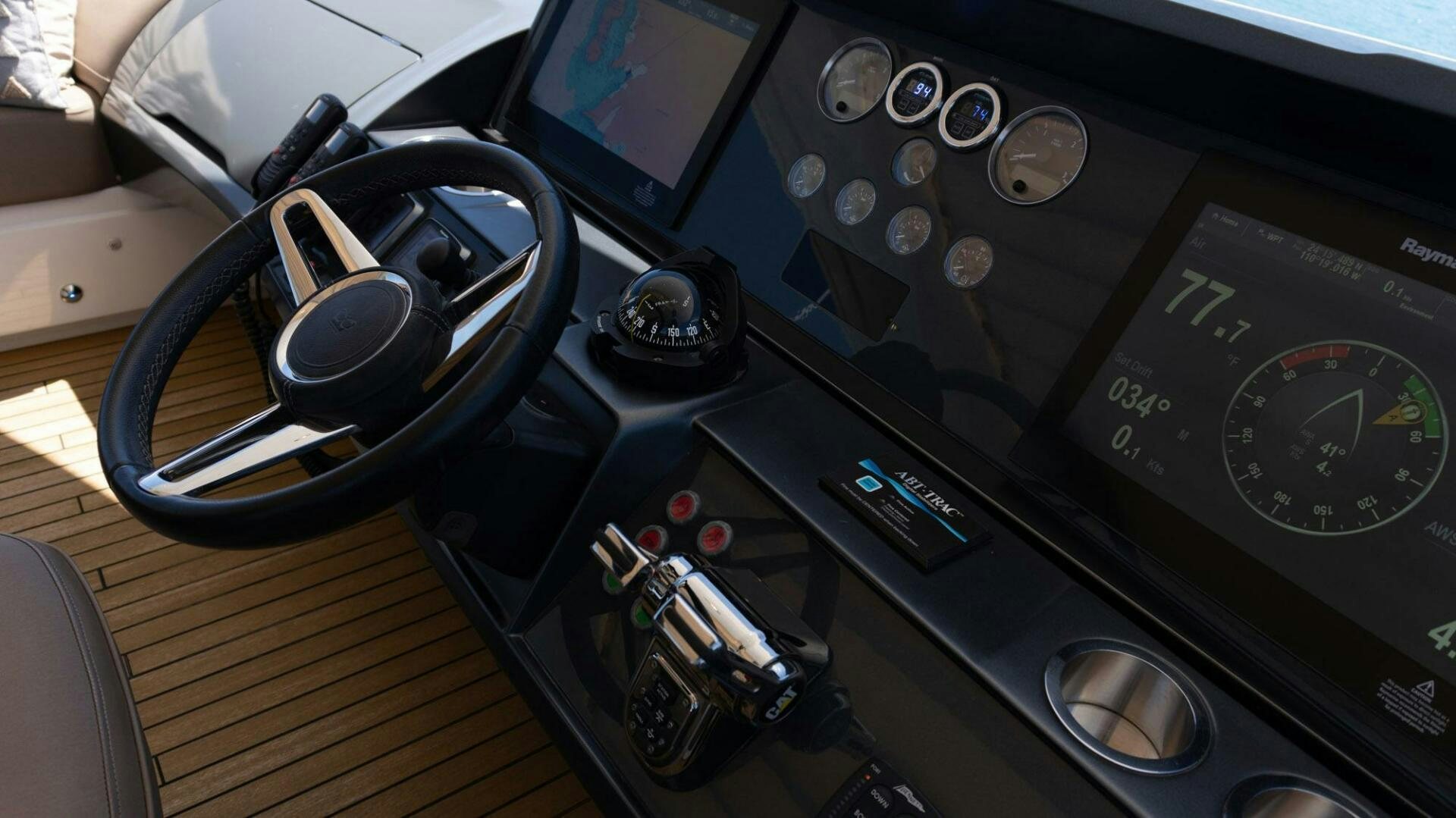 a car with a steering wheel aboard SATORI Yacht for Sale