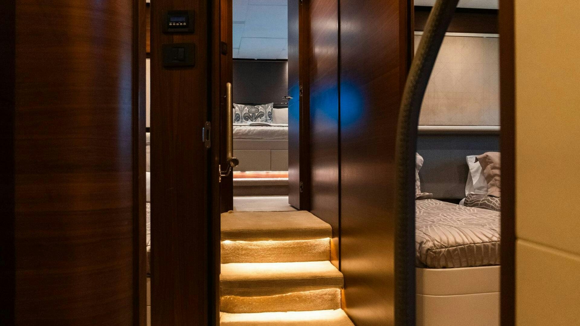 a room with a bed and a door aboard SATORI Yacht for Sale