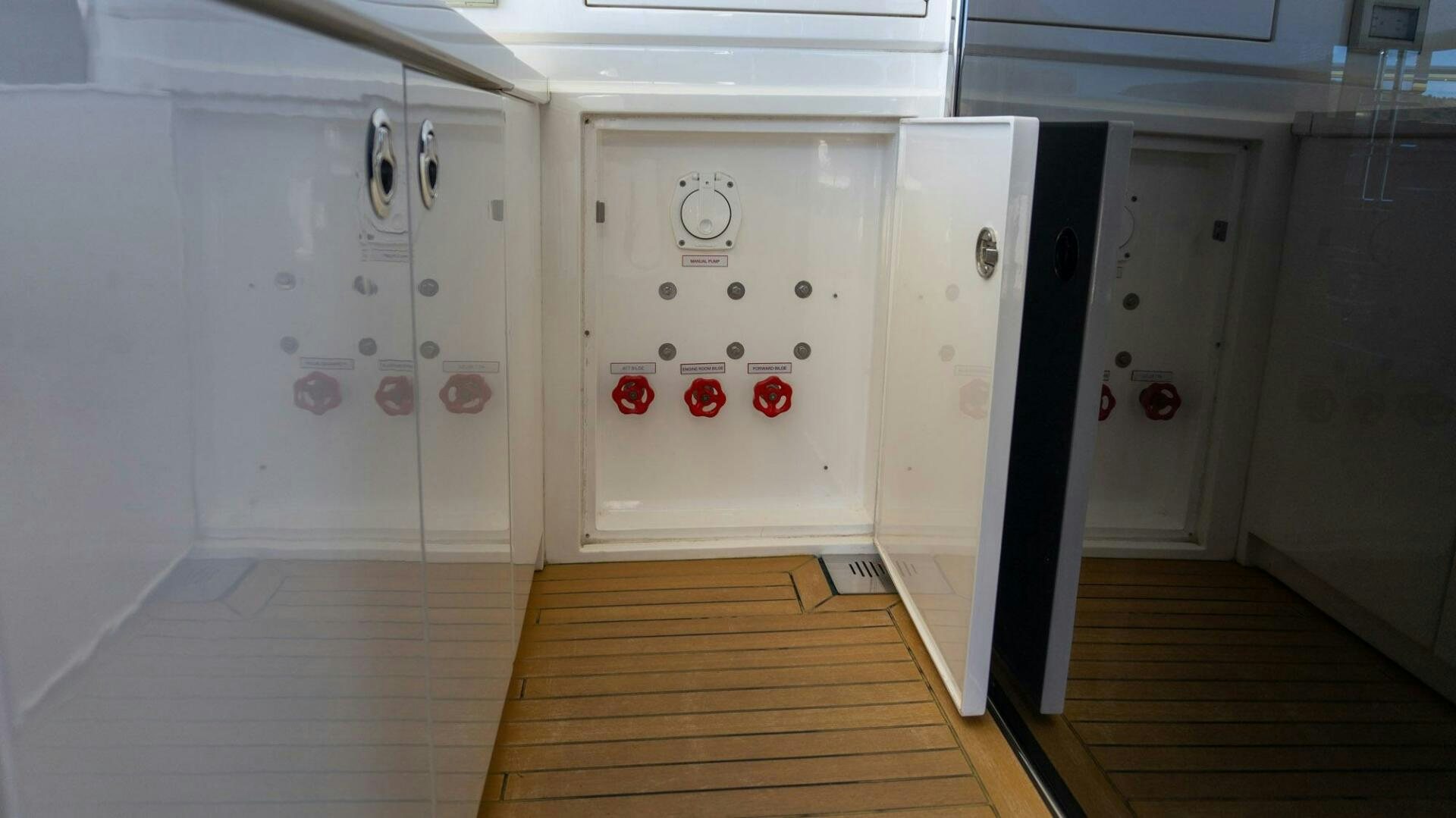 a room with white cabinets aboard SATORI Yacht for Sale