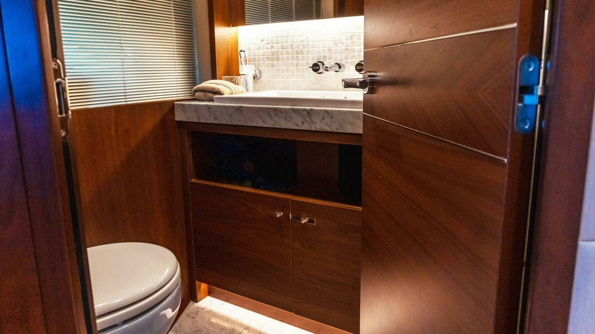 a bathroom with a sink and a toilet aboard SATORI Yacht for Sale