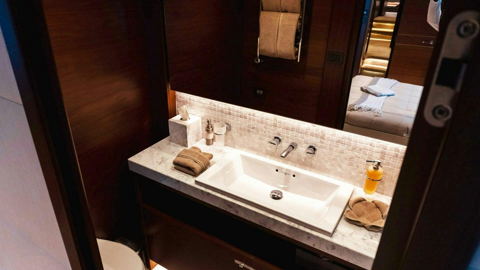 a bathroom with a sink and a mirror aboard SATORI Yacht for Sale