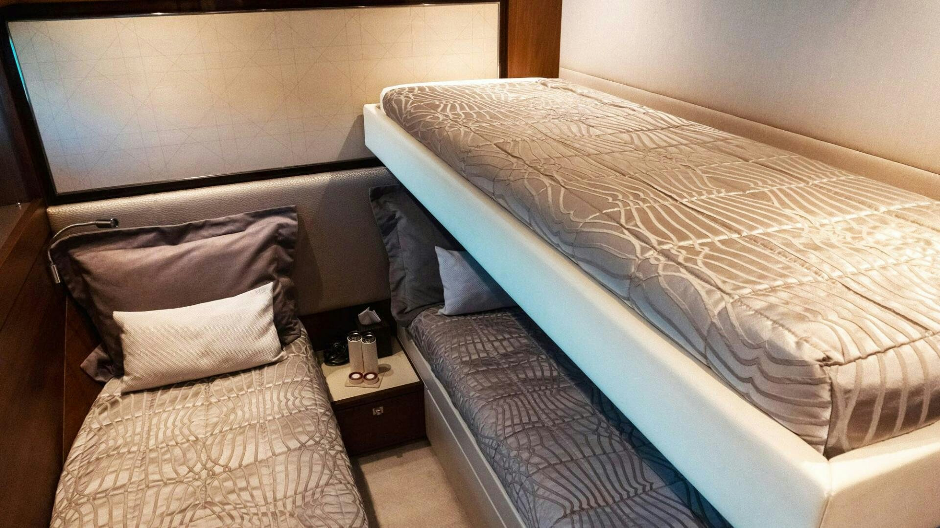 a couple of beds in a room aboard SATORI Yacht for Sale