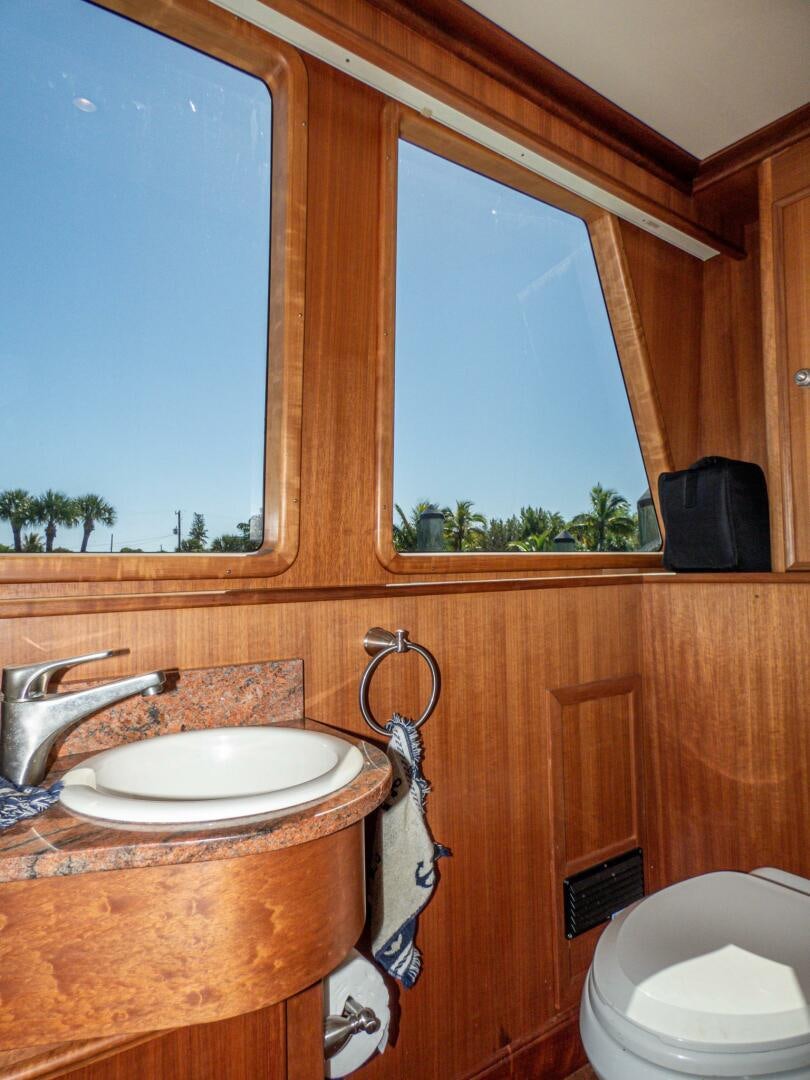 a bathroom with a sink and a toilet aboard IIWII Yacht for Sale