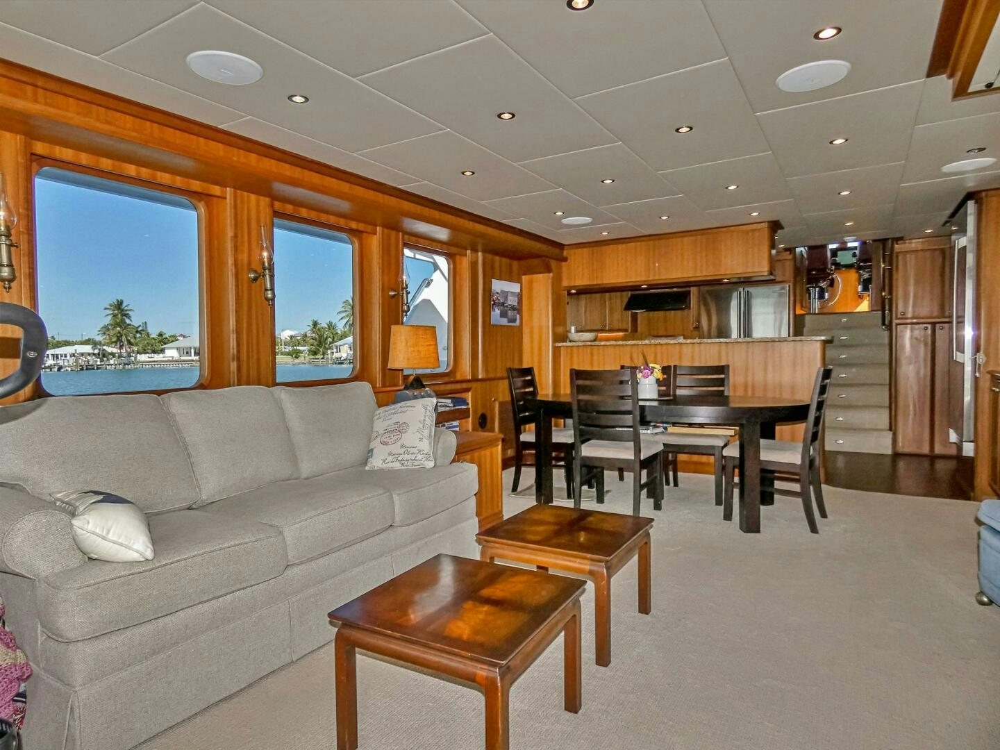 a living room with a couch and a table aboard IIWII Yacht for Sale