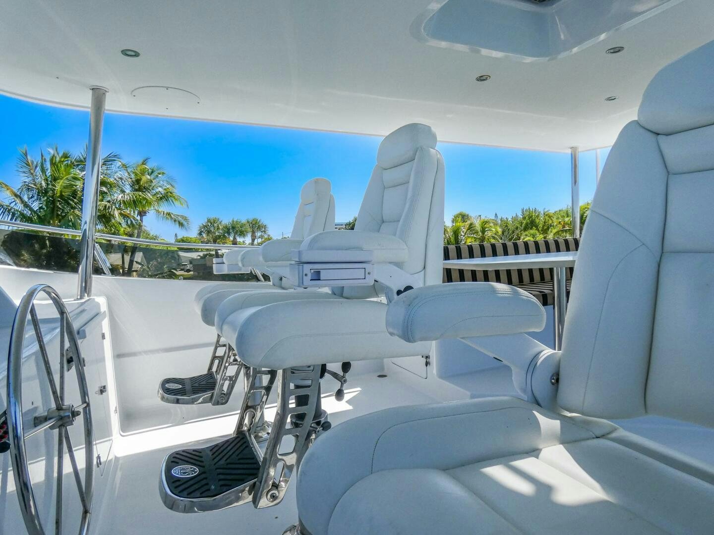 a boat with seats and a railing aboard IIWII Yacht for Sale