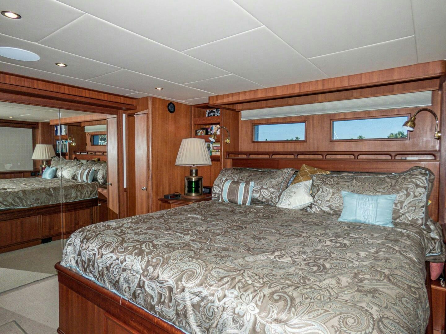 a bedroom with a large bed aboard IIWII Yacht for Sale