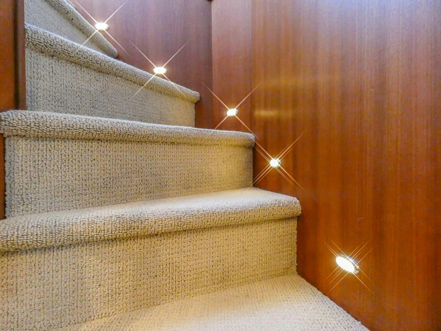 a brown couch with a light on it aboard IIWII Yacht for Sale