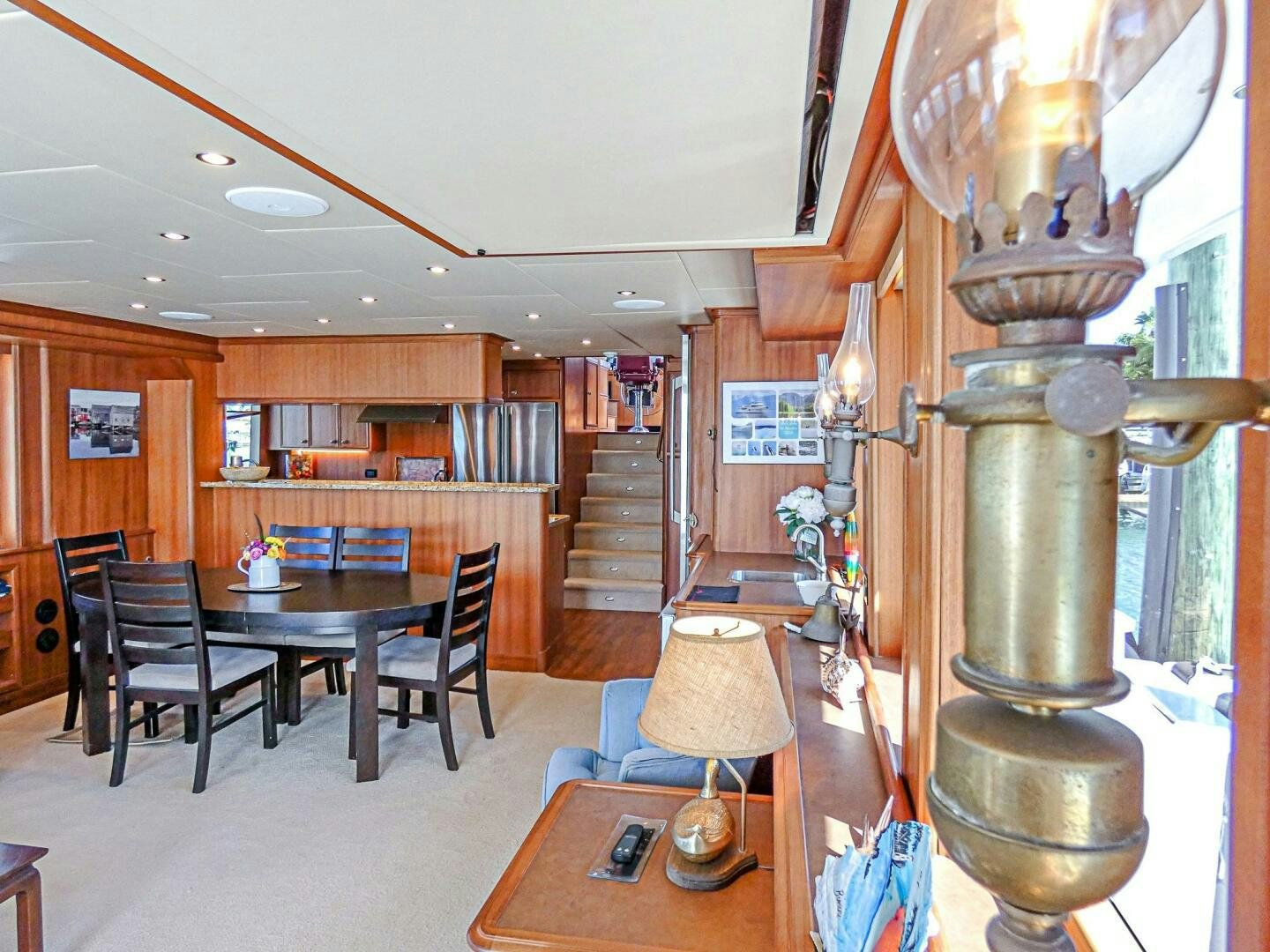 a room with a table and chairs aboard IIWII Yacht for Sale