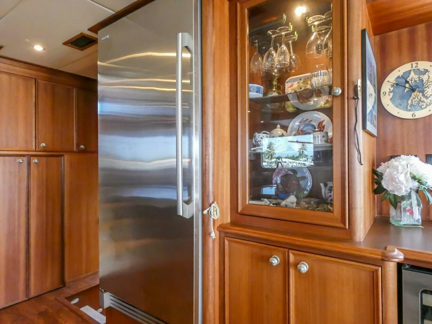 a glass door in a room aboard IIWII Yacht for Sale