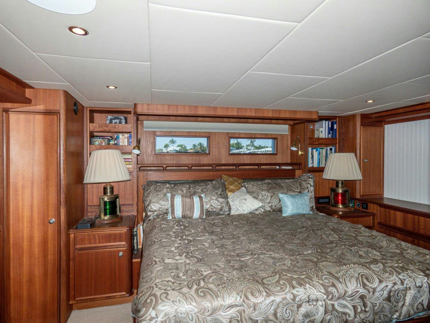 a bed in a bedroom aboard IIWII Yacht for Sale