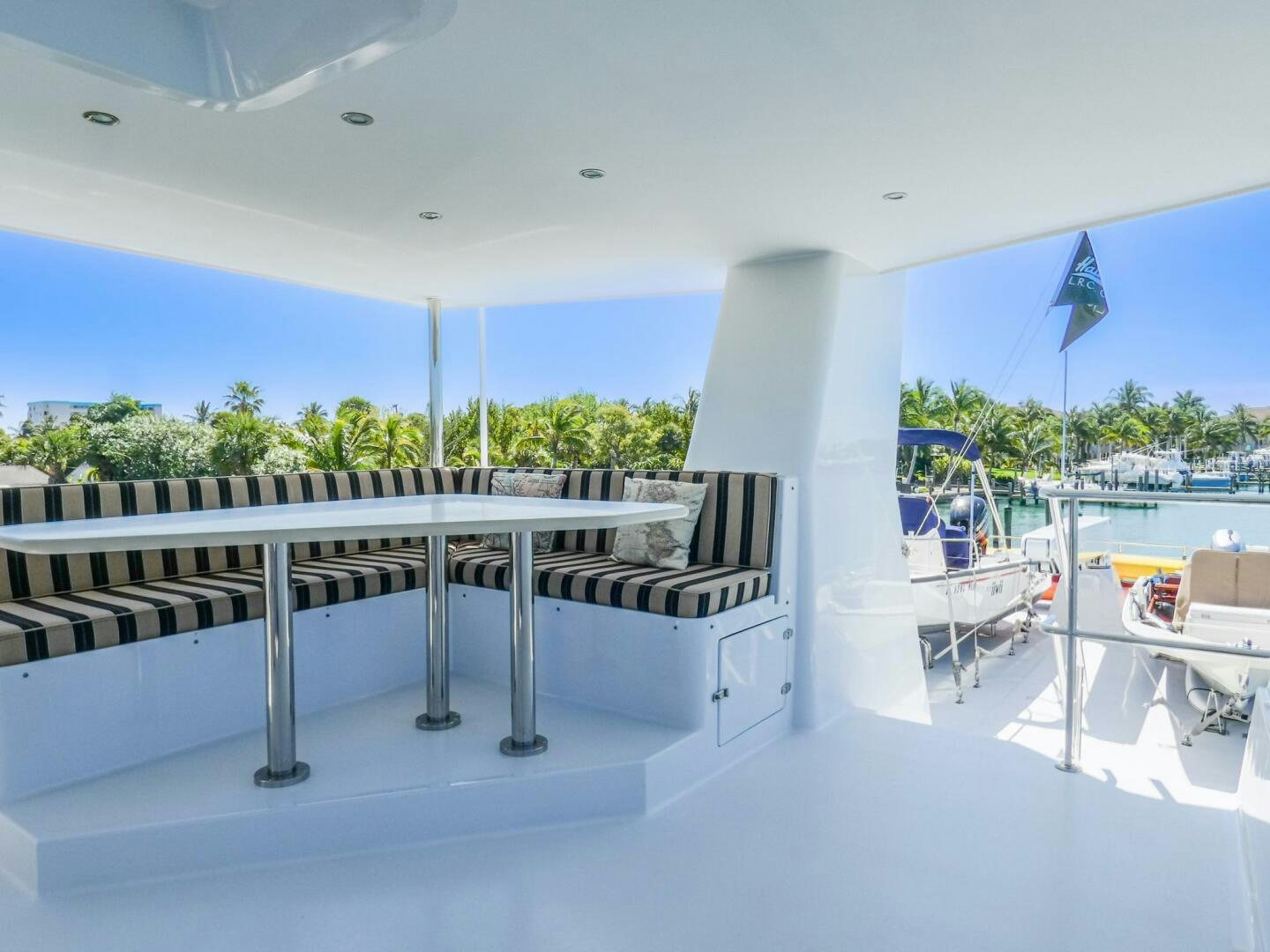 a large white building with a balcony aboard IIWII Yacht for Sale