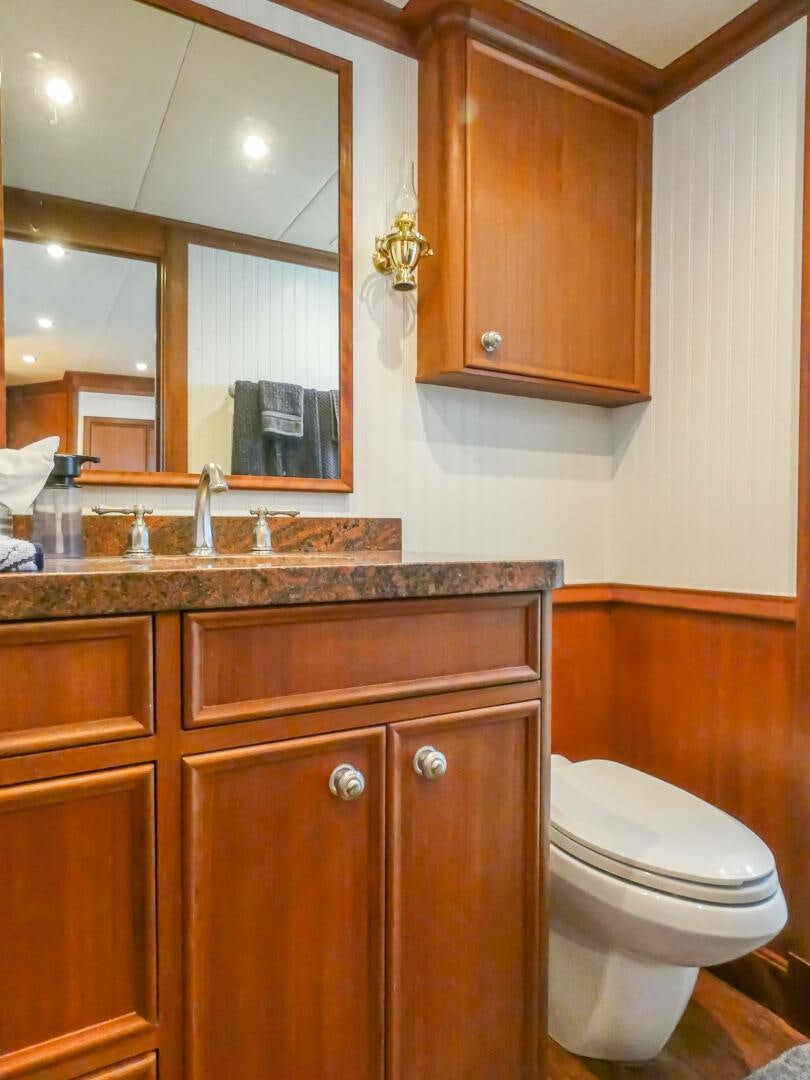 a bathroom with a sink and a toilet aboard IIWII Yacht for Sale