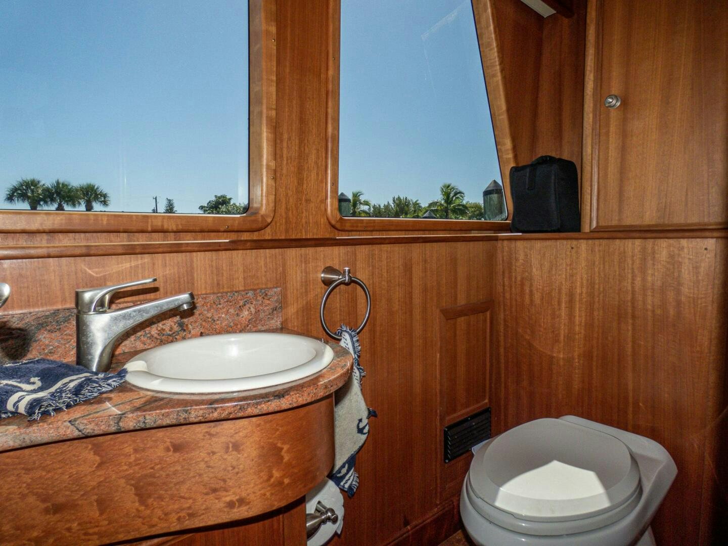 a bathroom with a sink and toilet aboard IIWII Yacht for Sale