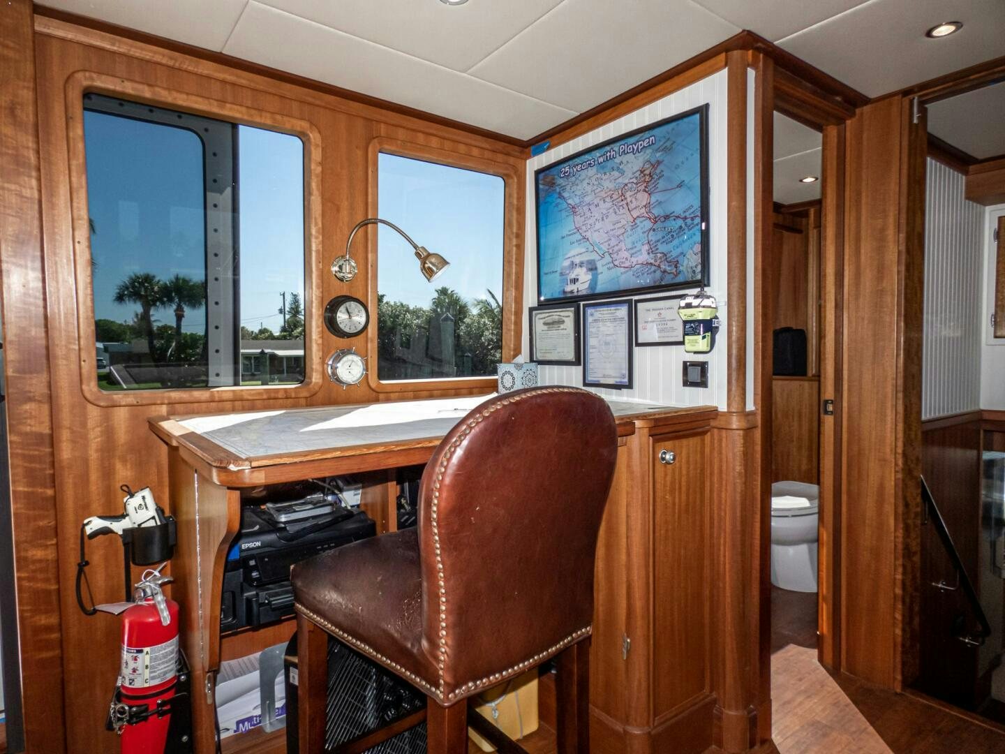 a kitchen with a sink and cabinets aboard IIWII Yacht for Sale
