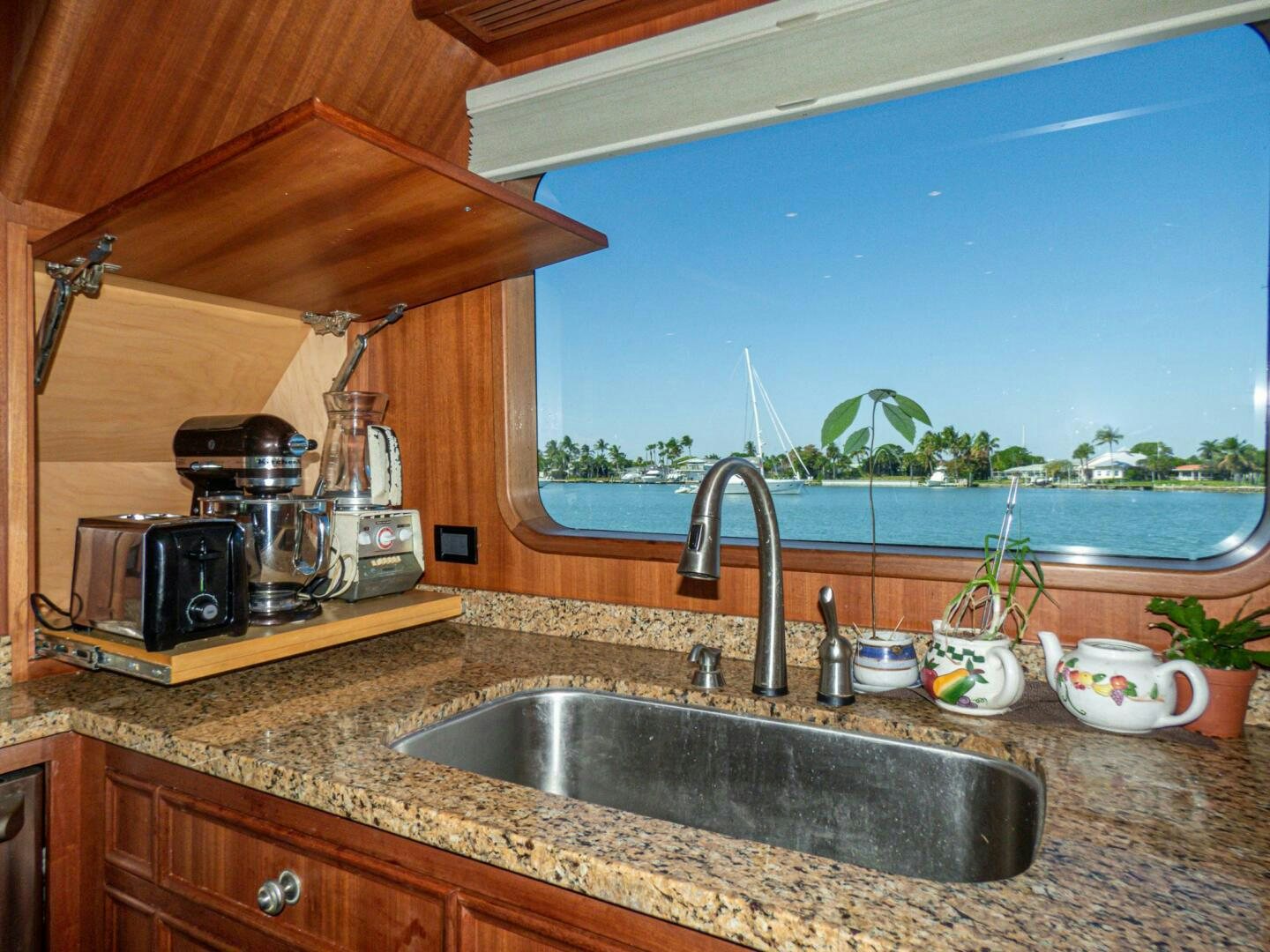 a kitchen with a sink and a microwave aboard IIWII Yacht for Sale