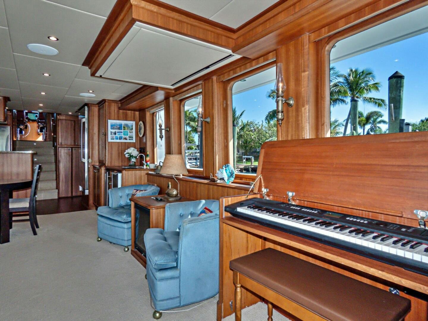 a piano in a room aboard IIWII Yacht for Sale