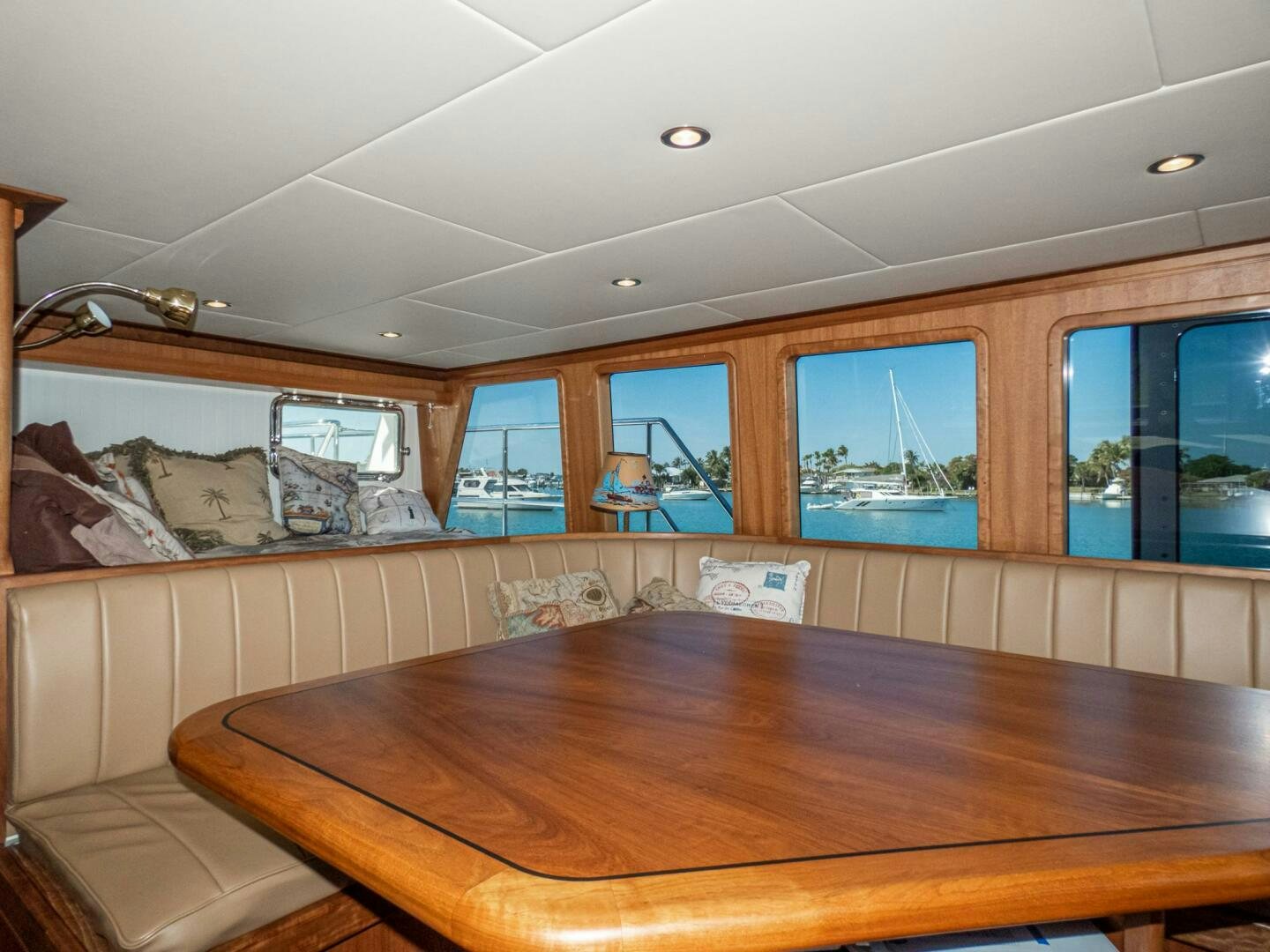 a room with a table and a window aboard IIWII Yacht for Sale