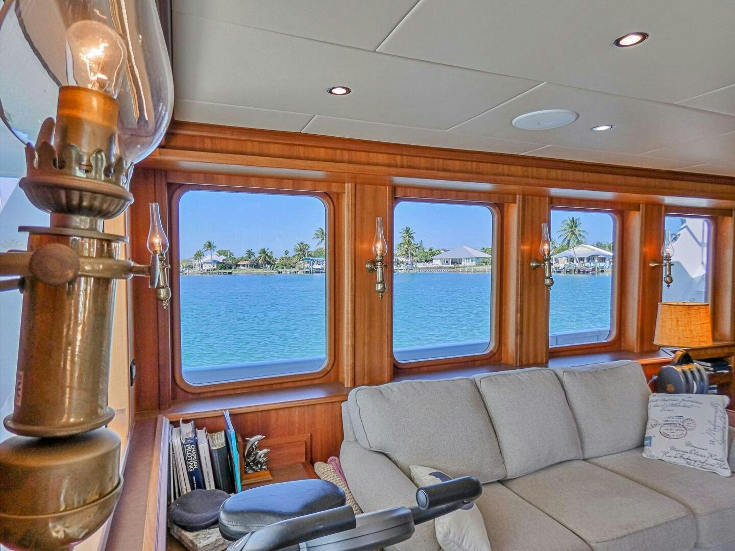 a living room with a couch and lamp aboard IIWII Yacht for Sale