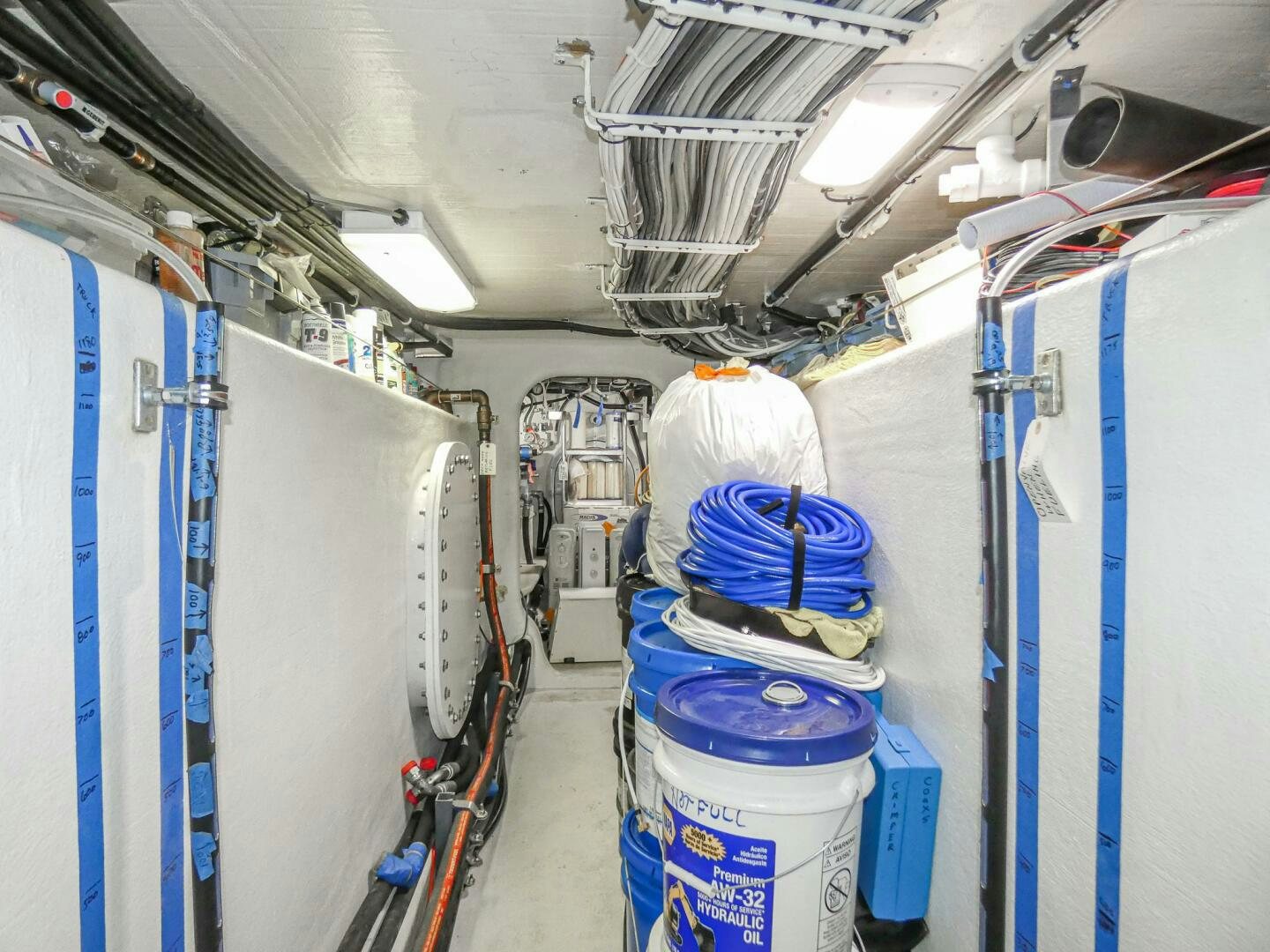 a room with blue and white machinery aboard IIWII Yacht for Sale