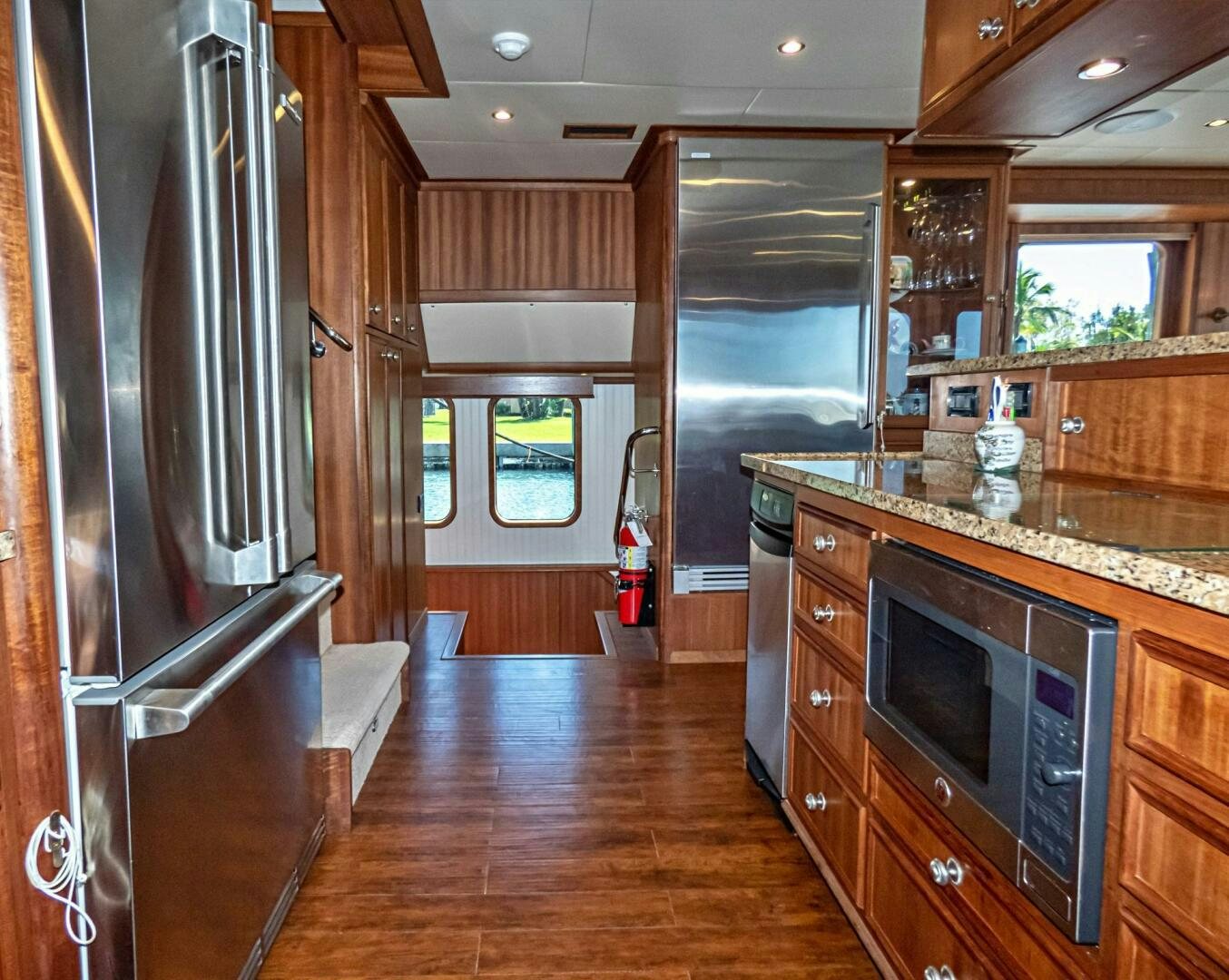 a kitchen with stainless steel appliances aboard IIWII Yacht for Sale