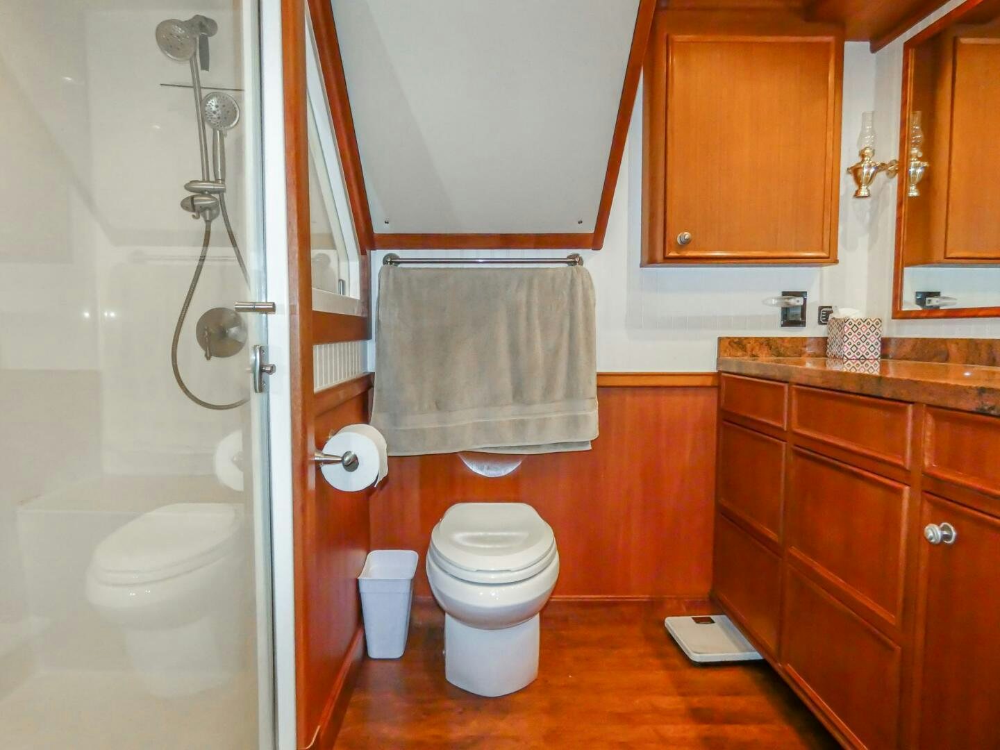 a bathroom with a toilet and a sink aboard IIWII Yacht for Sale