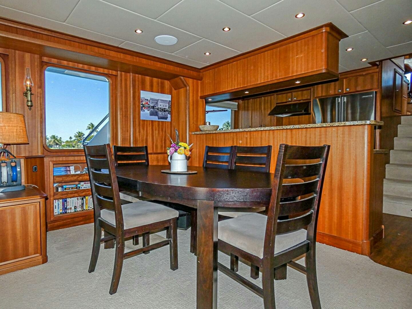 a kitchen with a dining table aboard IIWII Yacht for Sale