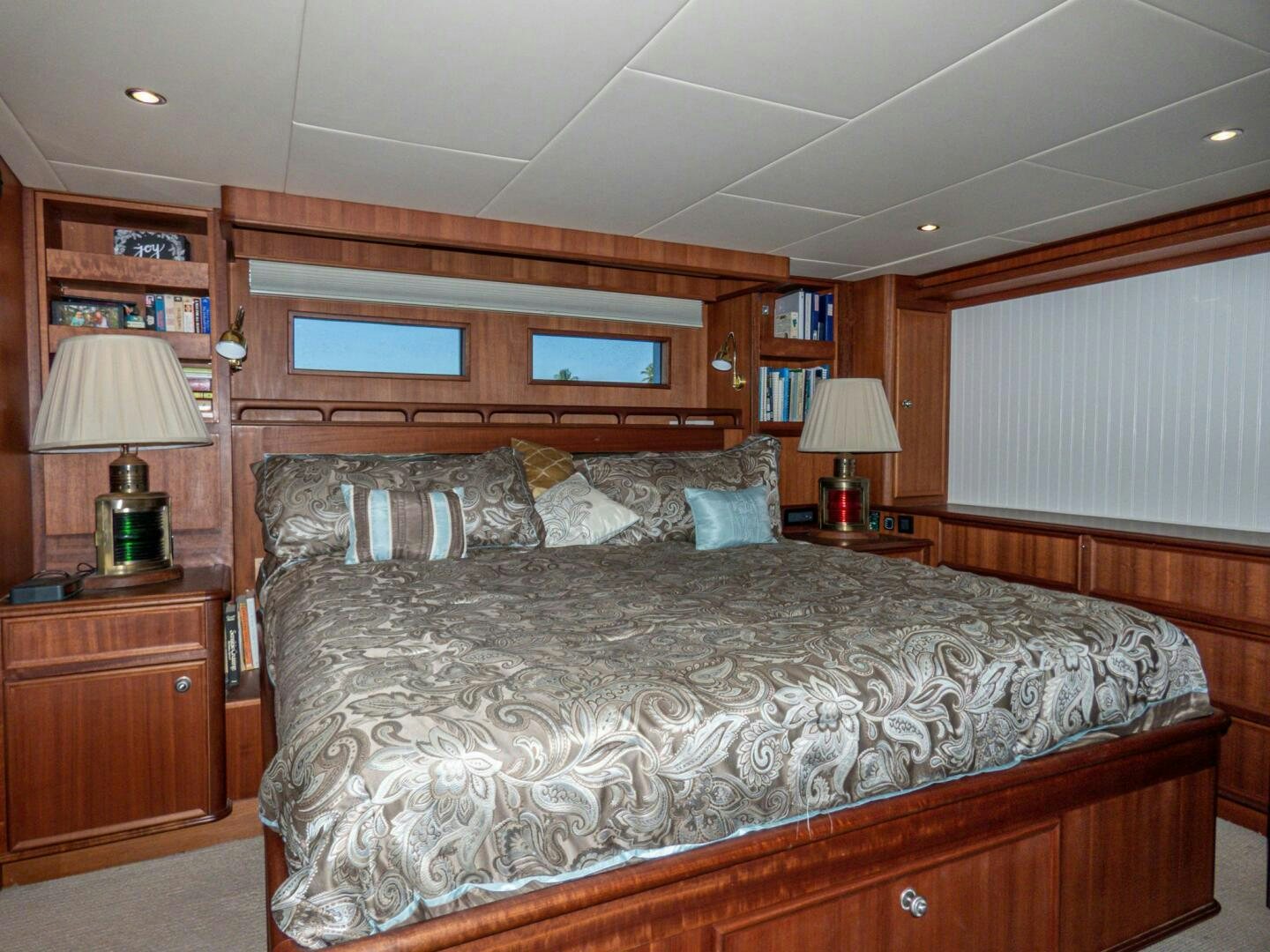a large bed in a room aboard IIWII Yacht for Sale