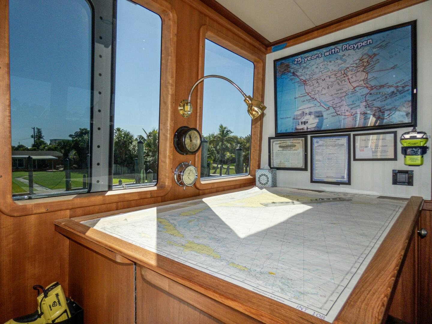 a room with a table and a mirror aboard IIWII Yacht for Sale