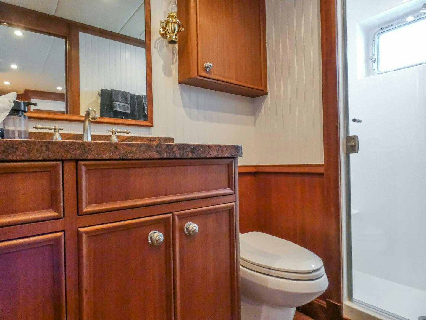 a bathroom with a marble counter top aboard IIWII Yacht for Sale