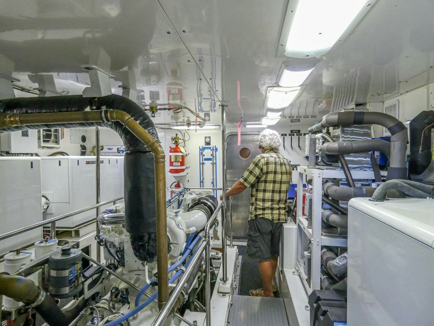 a person in a factory aboard IIWII Yacht for Sale