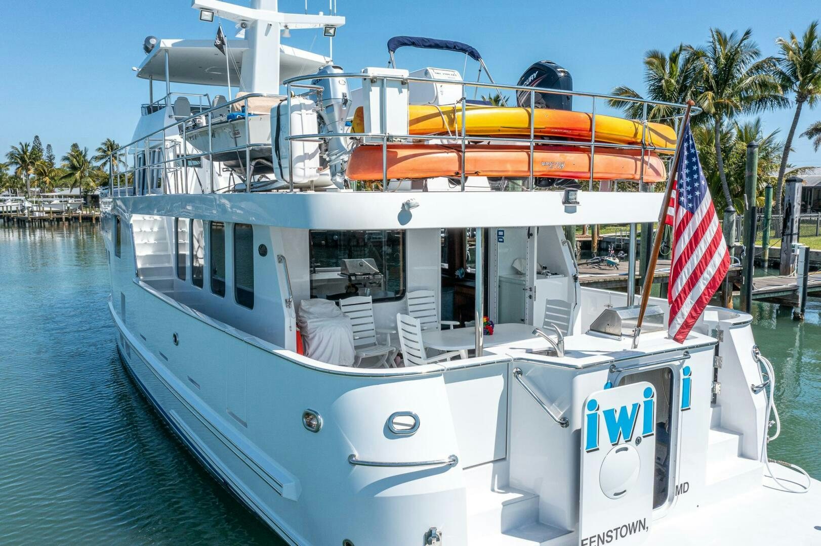 a boat with a flag on the front aboard IIWII Yacht for Sale