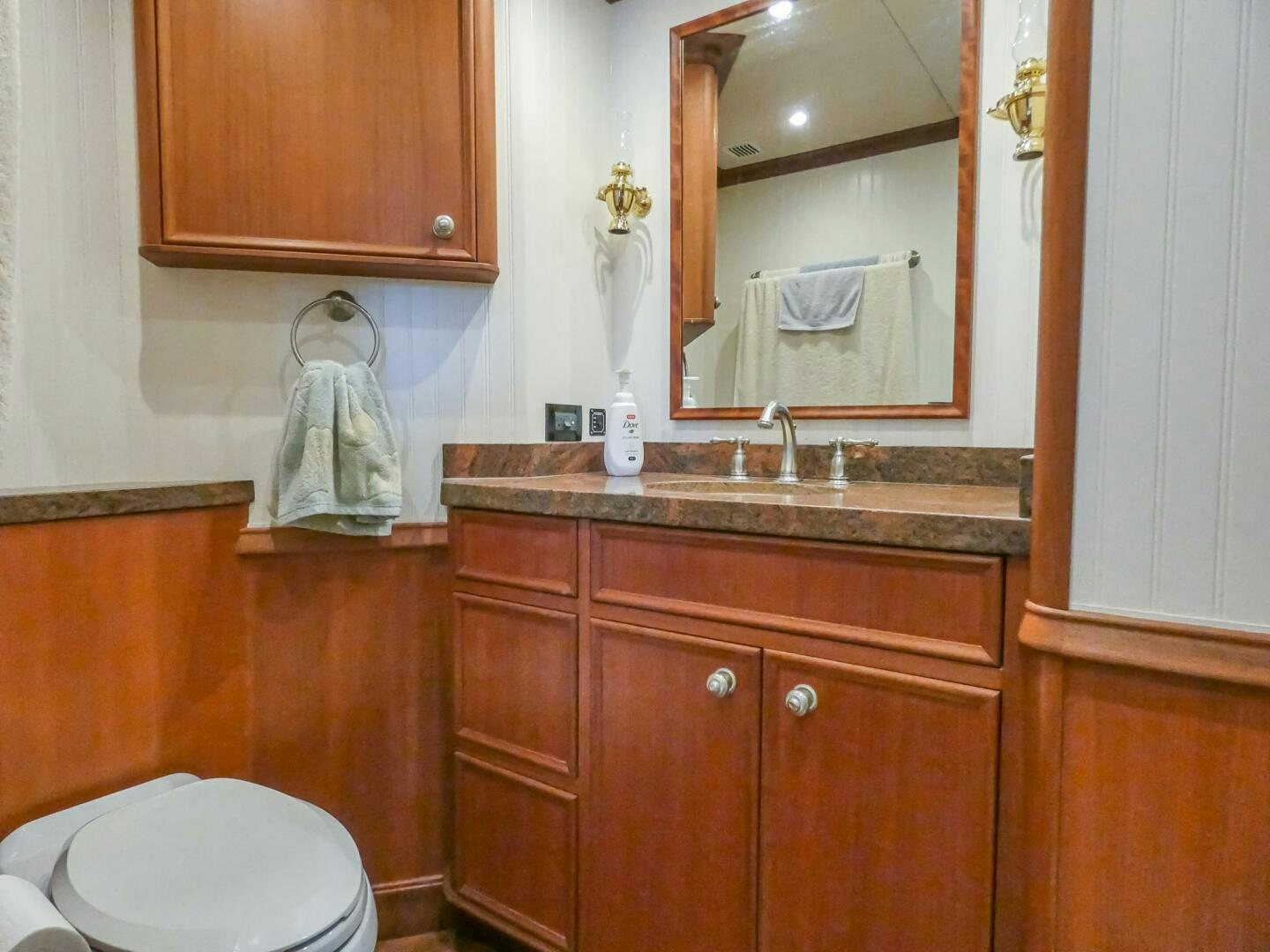 a bathroom with a sink and a mirror aboard IIWII Yacht for Sale