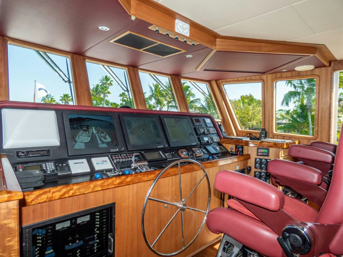 inside of a vehicle with a few monitors and a few seats aboard IIWII Yacht for Sale