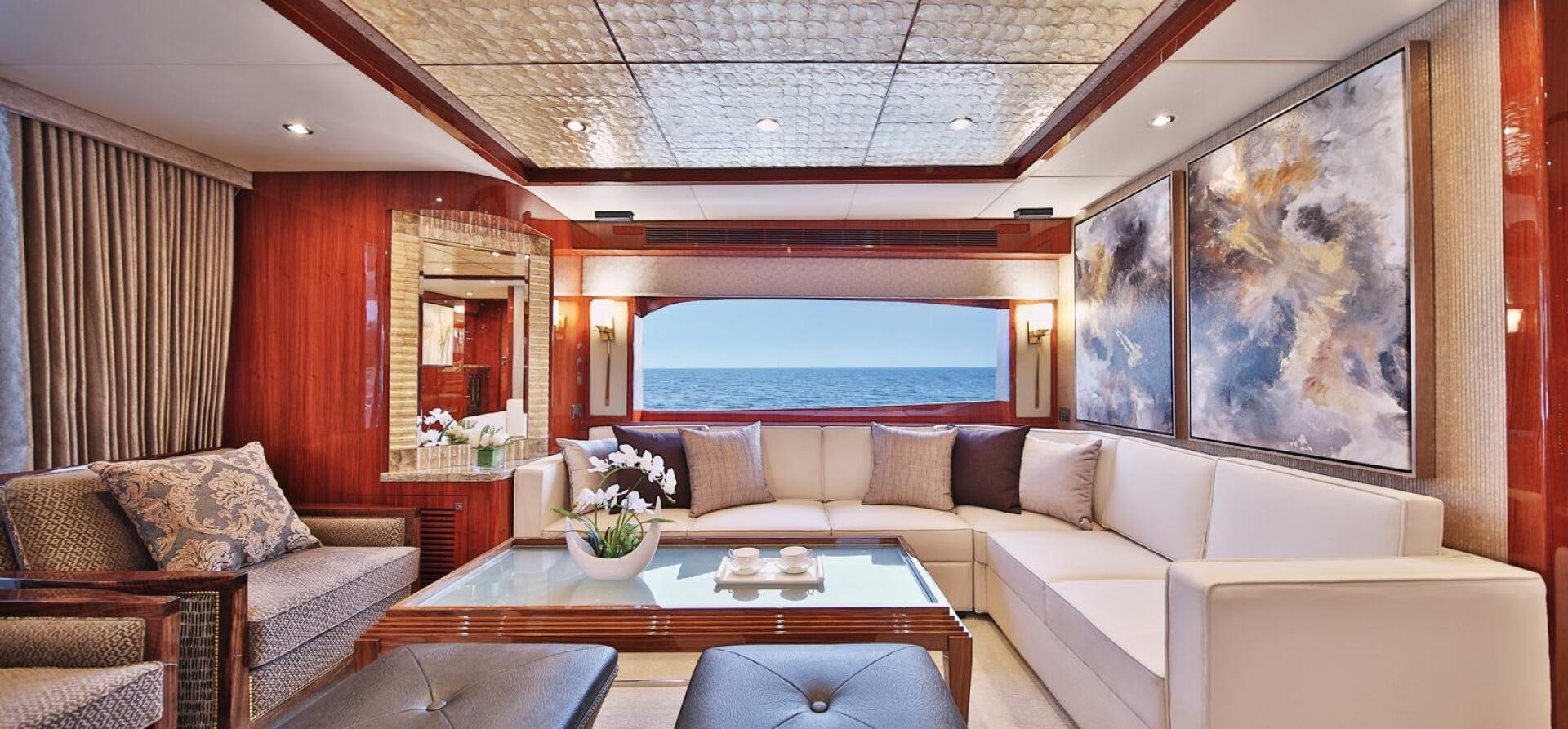 a living room with a large window aboard DEESCOVERY Yacht for Sale