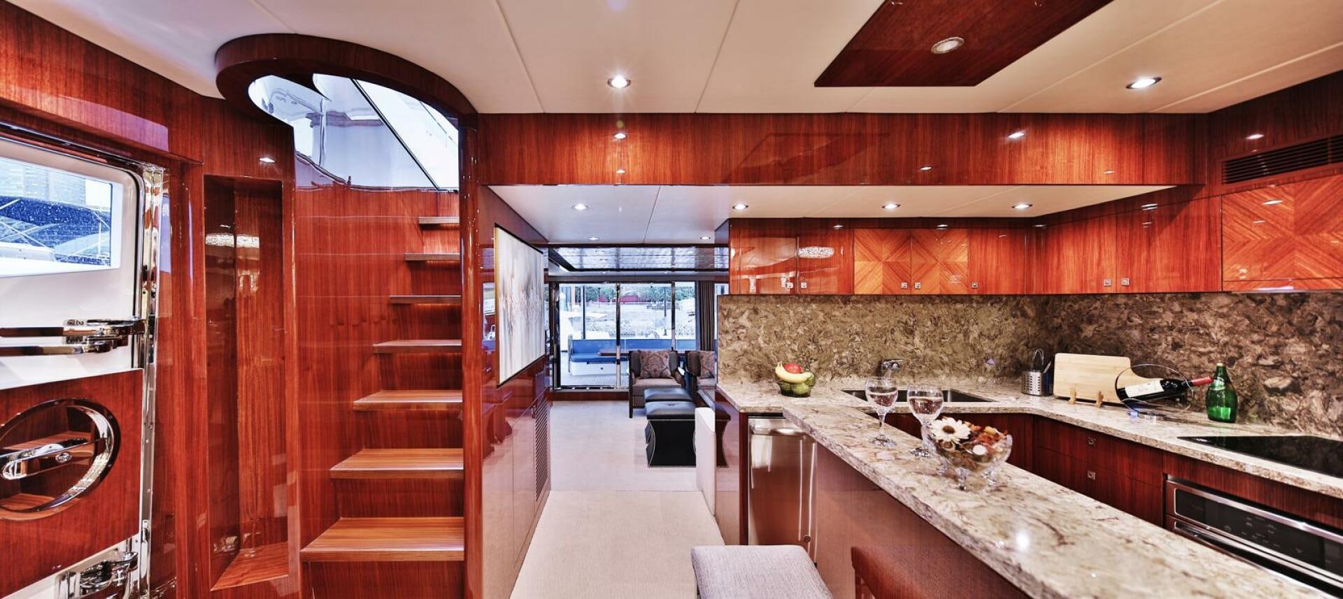 a kitchen with wooden cabinets aboard DEESCOVERY Yacht for Sale