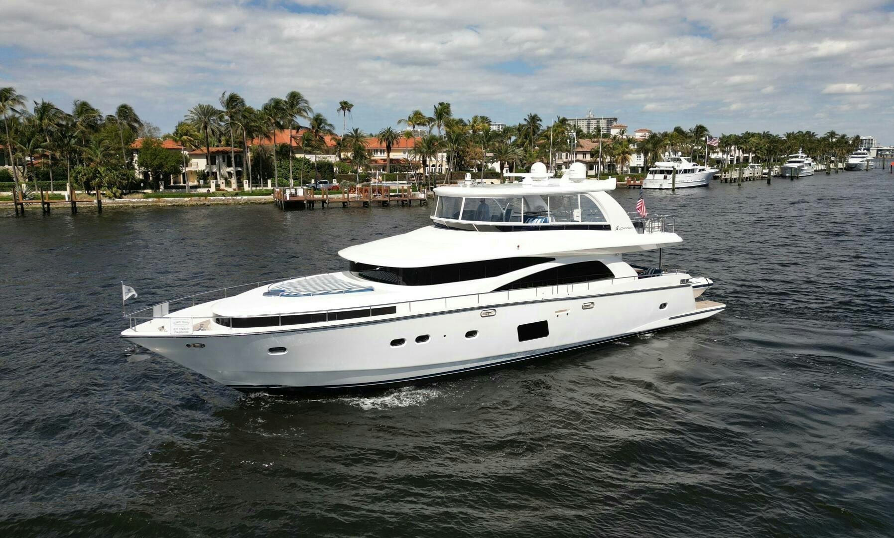 a white boat in the water aboard DEESCOVERY Yacht for Sale