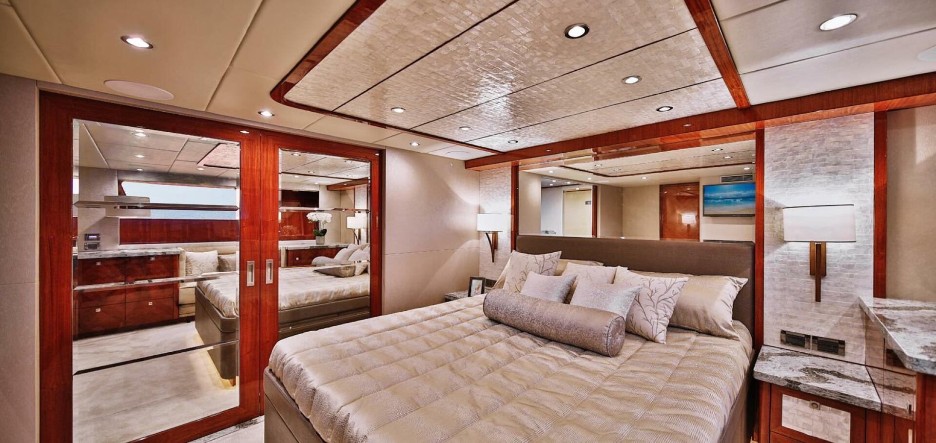 a room with a bed and a desk aboard DEESCOVERY Yacht for Sale