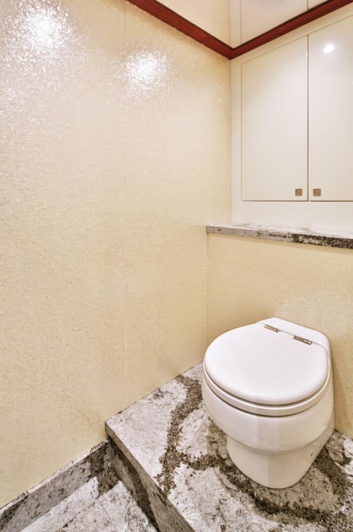 a toilet in a bathroom aboard DEESCOVERY Yacht for Sale
